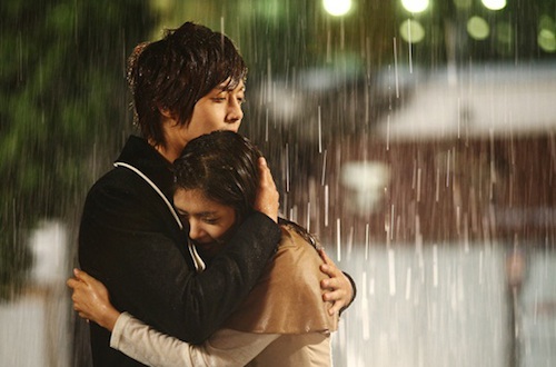 young couple kissing in the rain. Let#39;s all anticipate the “kiss